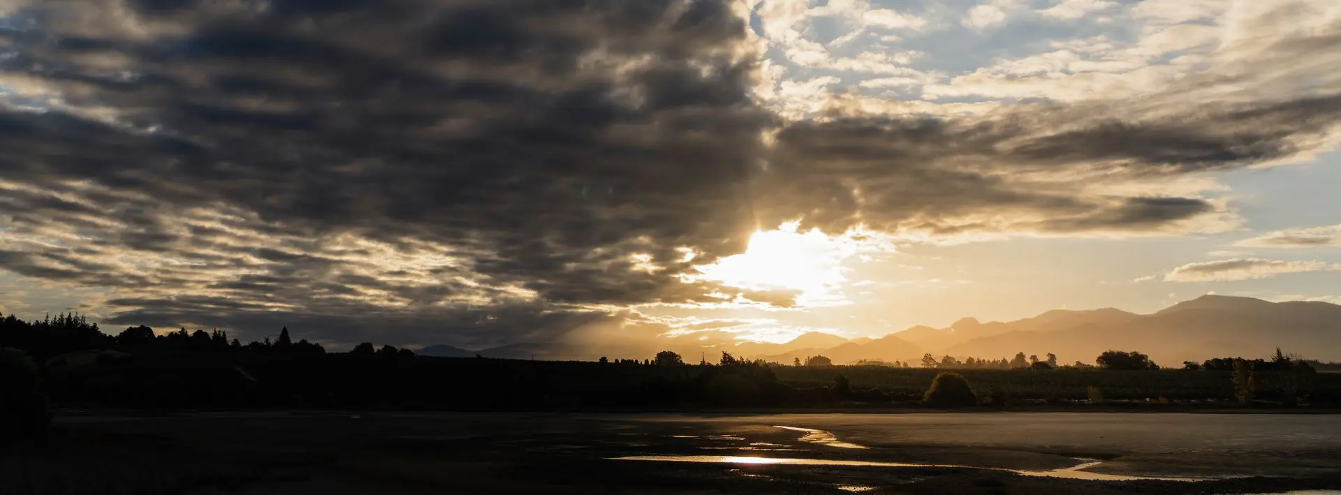 Sunset 14 A golden sunset breaking through dark clouds