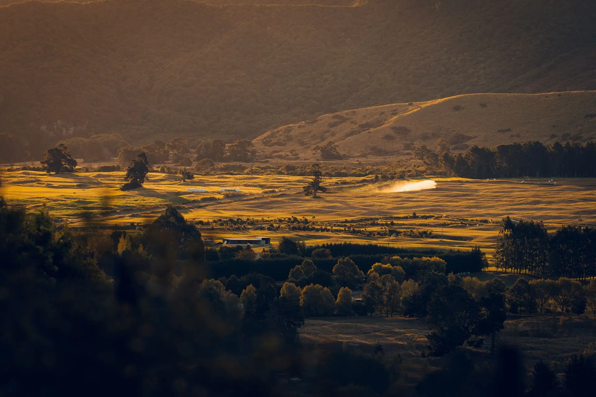 Dusty Summer A farmer works on a late summer day.